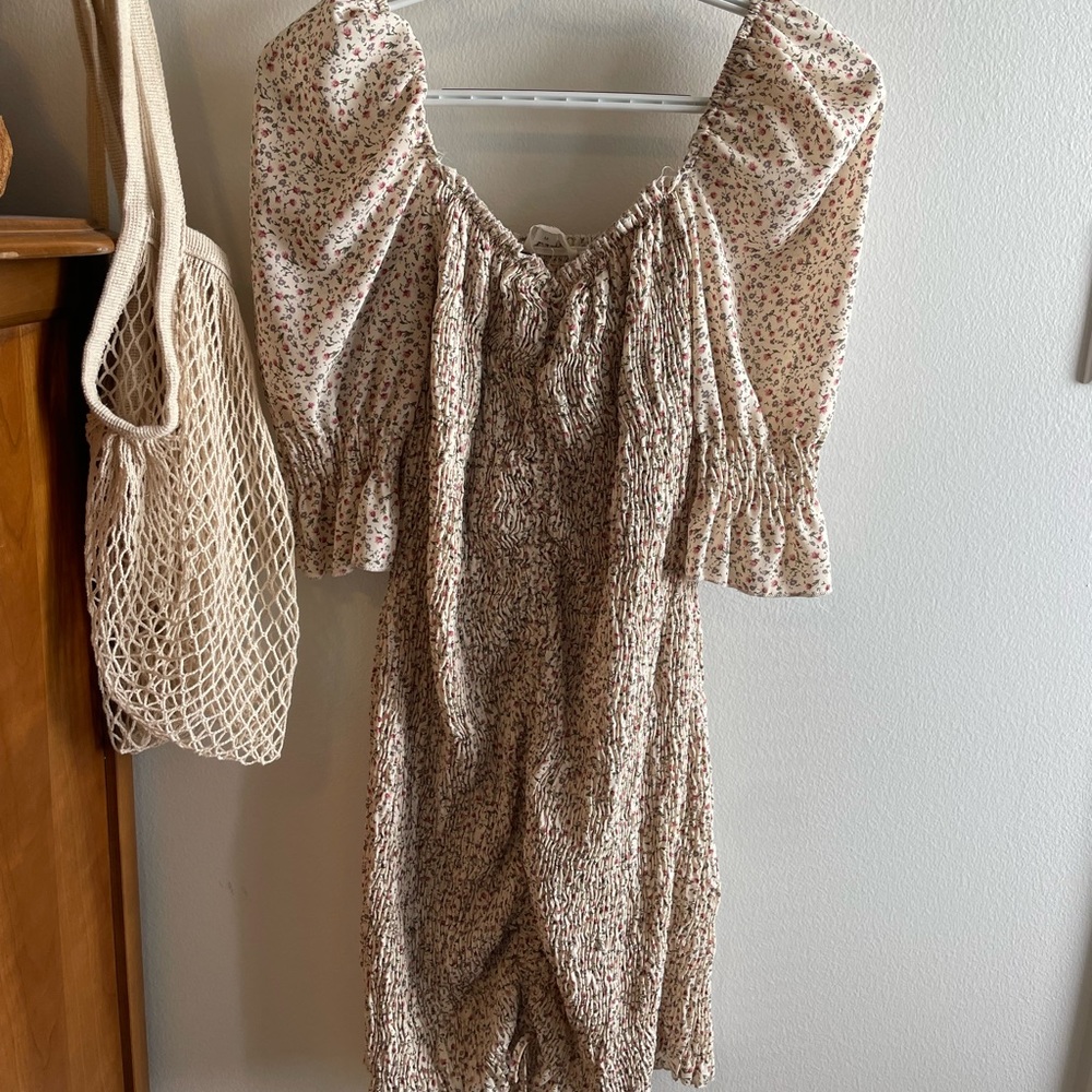 Floral ruffle dress with square neck and puff sleeves.